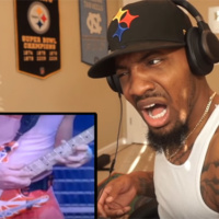 Watch this guy react to seeing Eddie Van Halen play guitar for the first time!